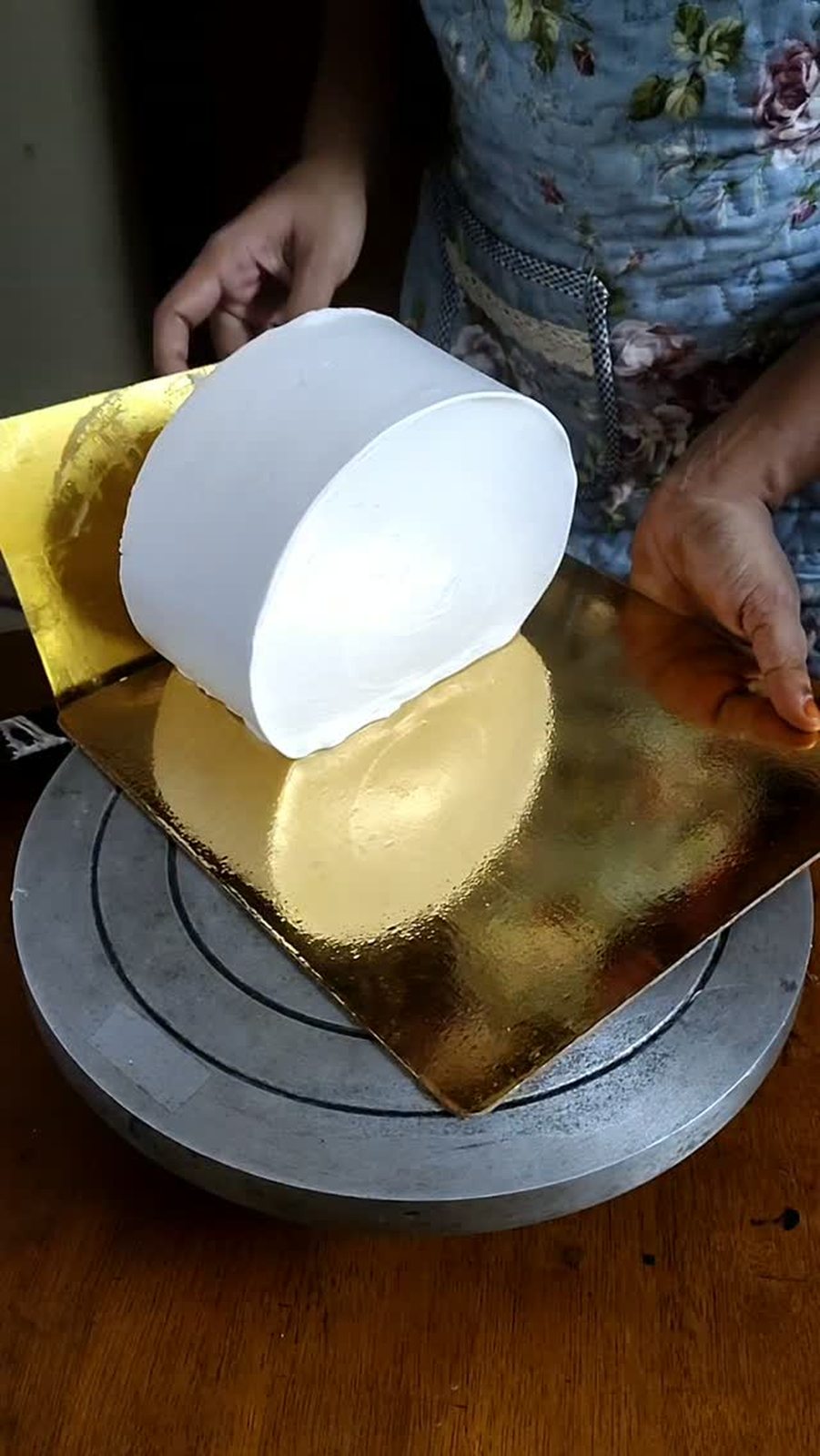 Cake being covered smoothly