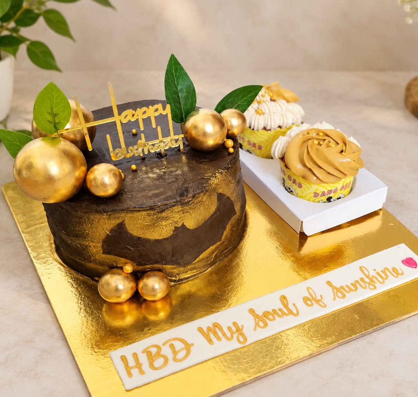 Chocolate gold cake with cupcakes