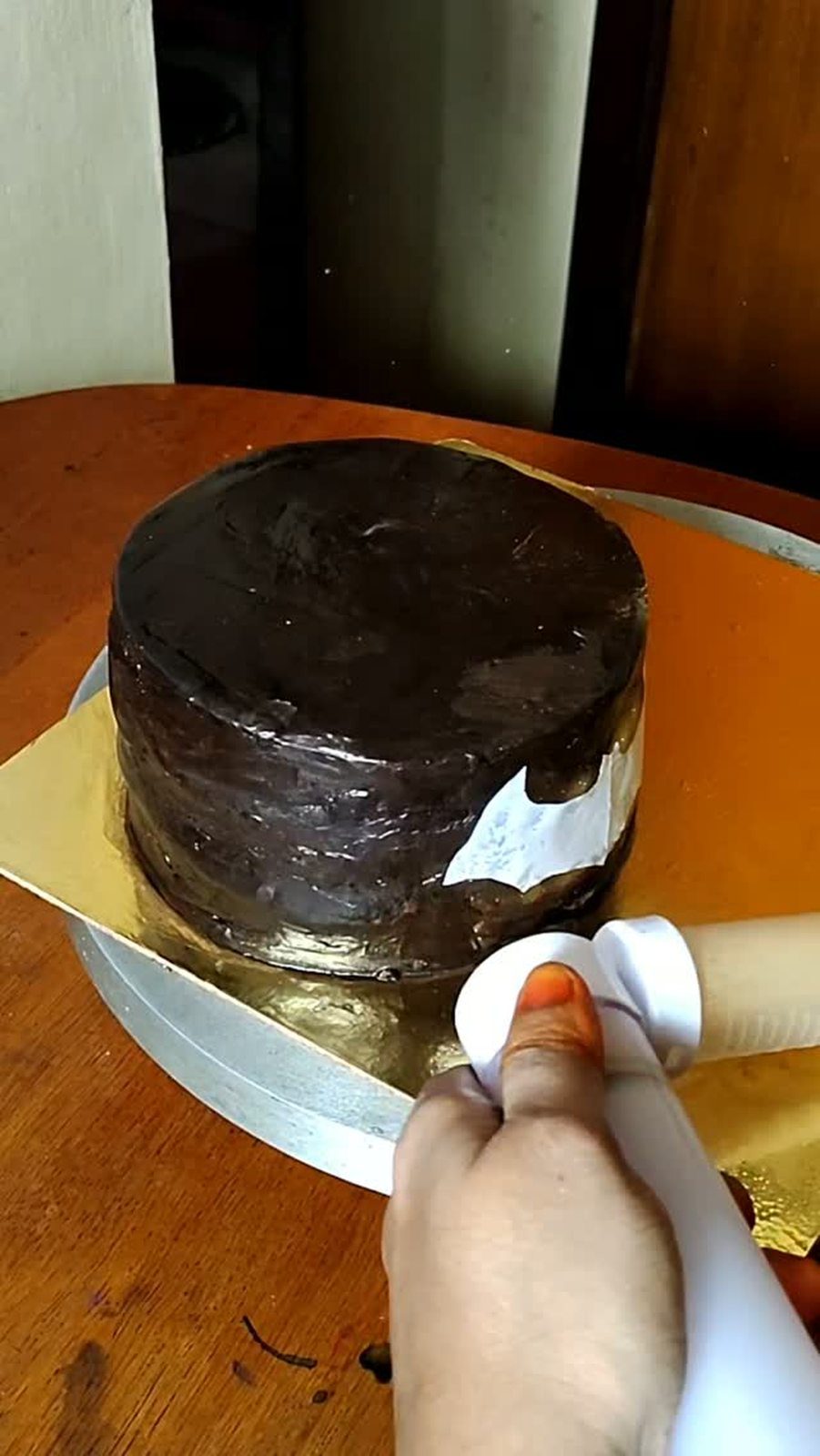 Chocolate frosting being spread