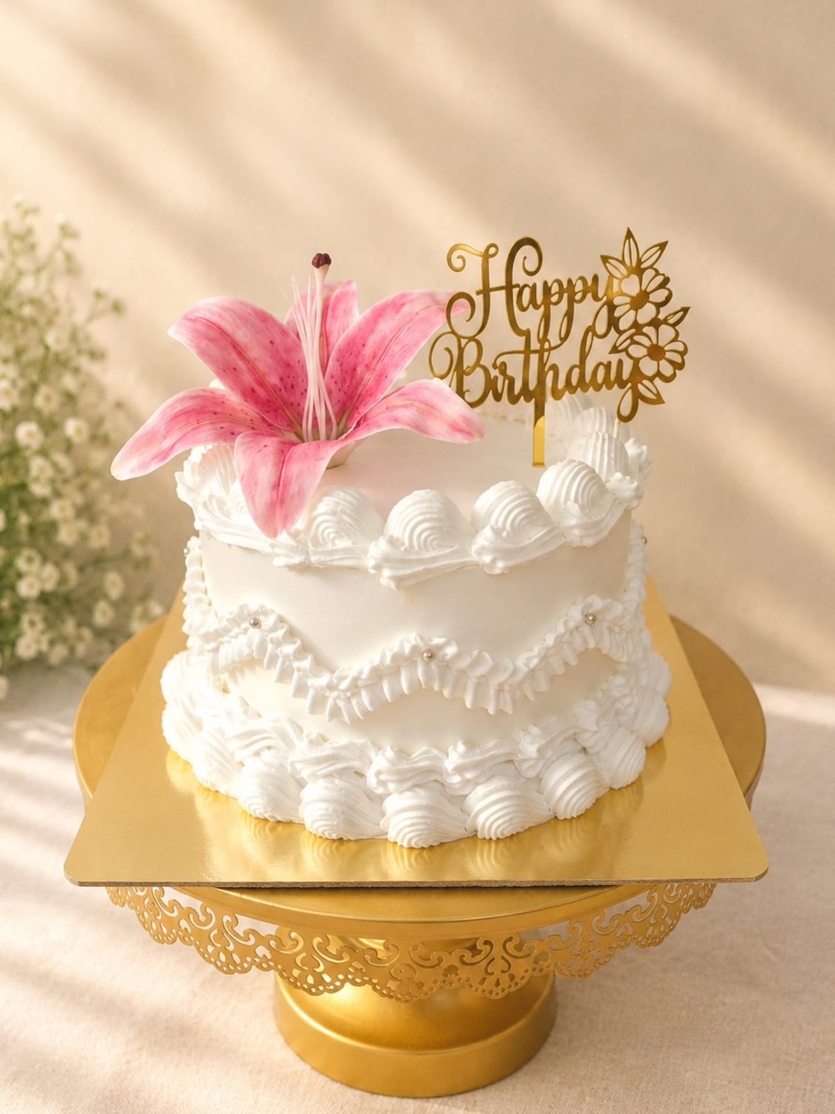 White ruffle cake topped with a fresh lily